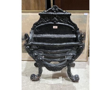 A Victorian cast iron fire grate. 17" wide.