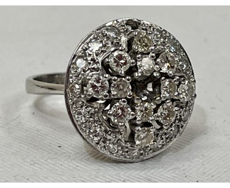 An 18ct white gold cluster ring. Two vacant settings, one loose stone with lot. The setting 20mm diam. 9g gross, size Q.
