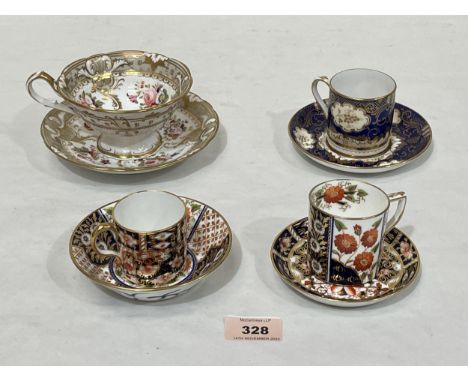 Three coffee cans and saucers and an early 19th Century tea cup and saucer, probably Coalport.