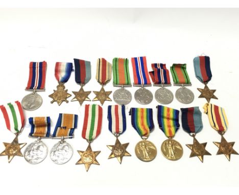 A Collection of WW1 and WW2 medals including Victory, Defence, 1939-45, Africa, France and Germany, Italy, 1914 stars. Presen