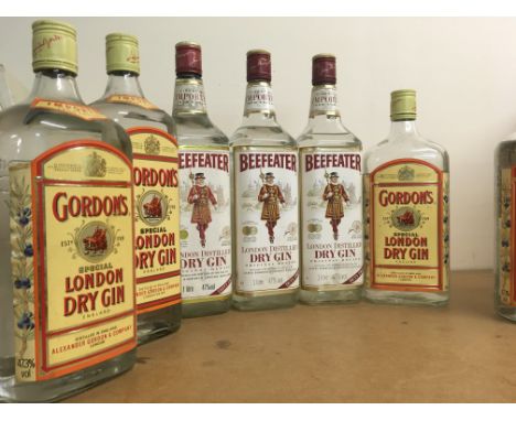 A Collection of nine bottles of gin, Gordonâ€™s and Beefeater.