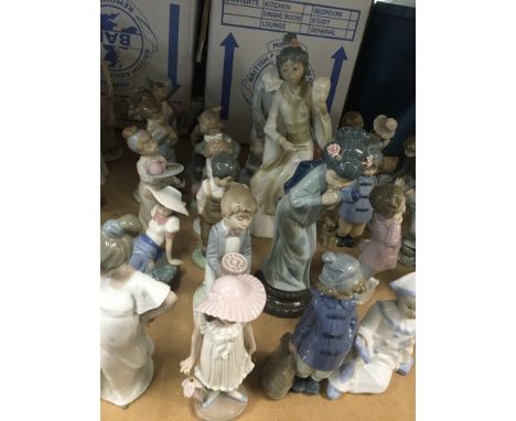 A collection of Nao figures including two large Geisha and boy with skateboard