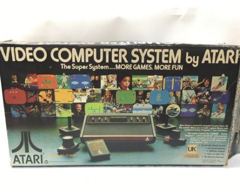 A boxed vintage Atari Video Computer System, Model No CX-2600. This lot cannot be posted