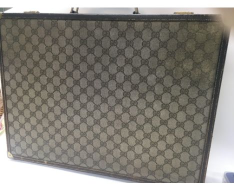 A Gucci 66 pattern canvas briefcase case with key .