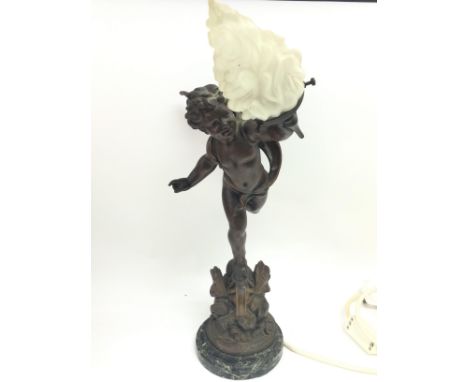 A French Cherub figure lamp with a frosted glass flame shade, L'Amour vainqueur. This lot cannot be posted