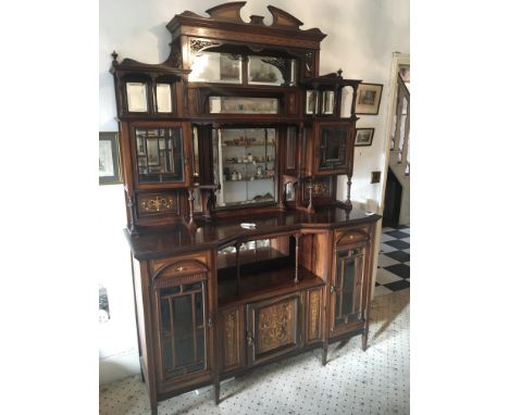 A fine quality Edwardian inlaid Rosewood chiffonier the raised back with mirrors and bevel edge glazed doors with an open sec