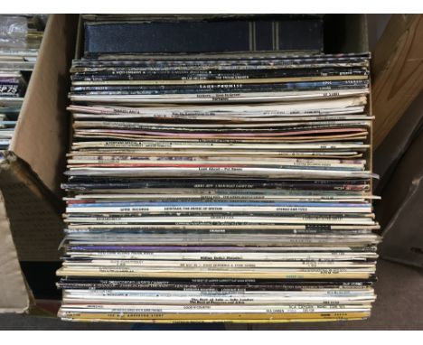 Three boxes and a record case of LPs y various artists including ABBA, Bob Dylan and others plus some film soundtracks (4).
