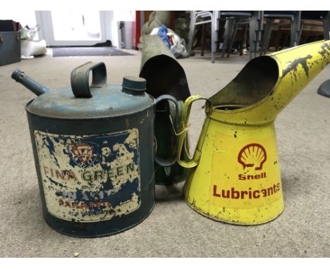 A vintage Castrol and Shell oil jugs and fina paraffin can. Tallest can 27cm