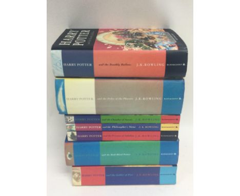 A collection of Harry Potter books including four first editions. Postage category C