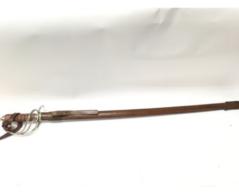 A Royal Artillery Officers sword by Wilkinson with a leather scabbard , 110cm total length. This lot cannot be posted