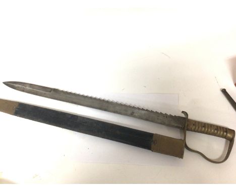 A 19th Century Pioneer 1856 pattern bayonet sword with saw edge blade made by Wilkinson and with further military stamps to t