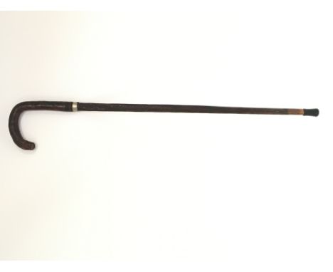 An antique full blade leather covered sword stick , with a sterling silver collar . Stick 85cm in length