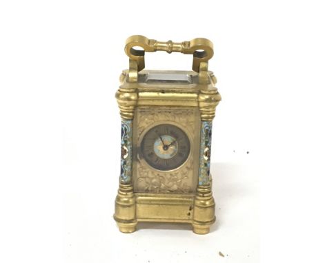 A Quality miniature gilt metal and enamel decorated Carriage clock with raised floral decoration Height 8cm with outer box an