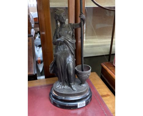 A vintage classical style lady lamp. (D)