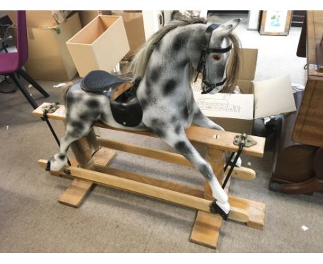 A vintage wooden rocking horse. 100cm tall. 114cm long approximately. This lot cannot be posted