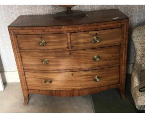 A late George III chest of drawers fitted with two short and two long drawers with satinwood banding and bracket feet. 107x52