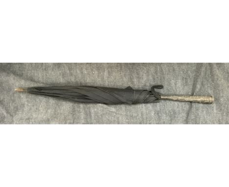 A vintage eastern parasol with white metal parasol (D). NO RESERVE