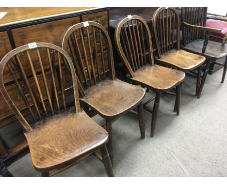 A set of four elm stick back chairs with military stamped together with two stick back chairs .