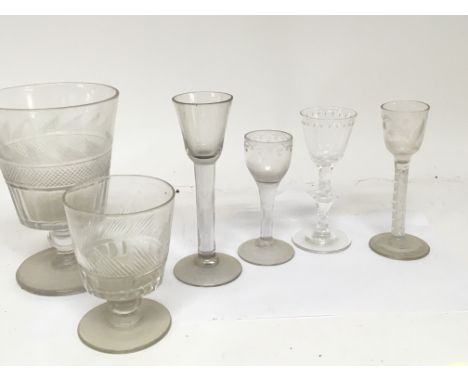 Four 18th century drinking glasses with air twist and cut stems and wheel etched decoration and two 19th century cut glass ru
