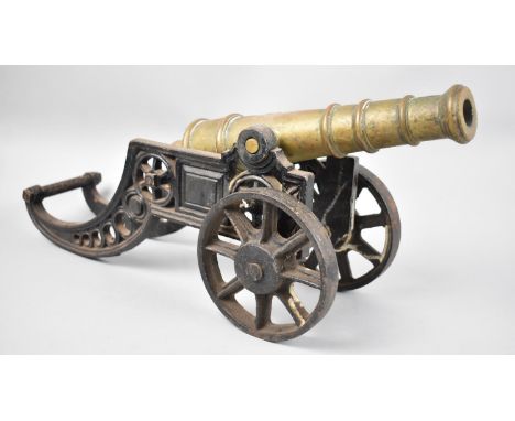 A Large Cast Iron and Brass Model of a Spanish Cannon, 47cms Long
