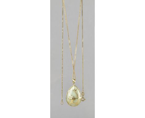A Jade and 14ct Gold Metal Pendant on a 9ct Gold Chain, Pear Shaped Pendant Measuring 34mm by 18.7mm Wide (including Bale) an
