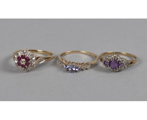 Three 9ct Gold Mounted Jewelled Rings to include Diamond and Tanzanite, Amethyst and Diamond and Ruby Cluster, 6.4gms