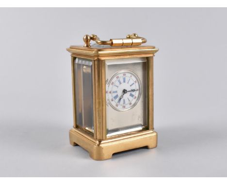 A Reproduction Miniature Gilt Brass Cased Carriage Clock with White Enamel Dial, No Key but Working Order, 5.5cms High