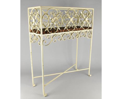 A White Painted Wrought Metal Planter of Rectangular Form with Twisted X Frame Stretcher, 60x21x72cm high
