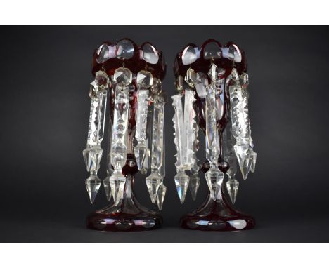 A Pair of Late 19th Century Bohemian Overlaid Ruby Glass Lustres with Spare Droppers, 27cms High