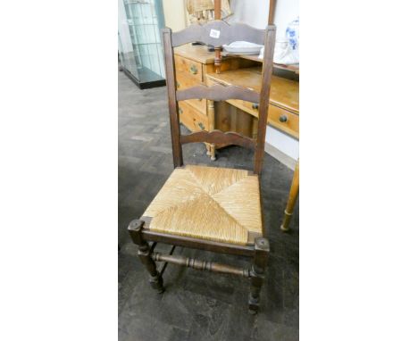 A sex of six oak ladder back rush seated dining chairs 