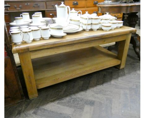 A contemporary chunky light oak two tier rectangular coffee table 