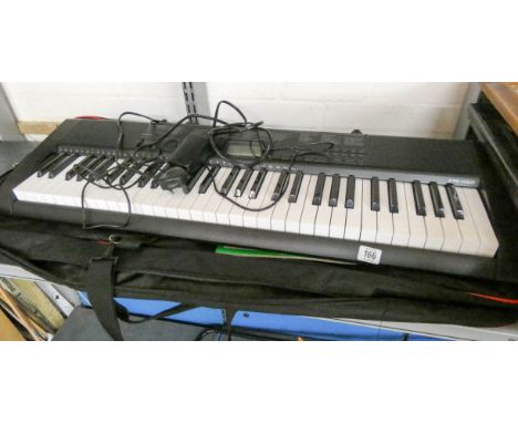 A Casio electric piano with carrying case 