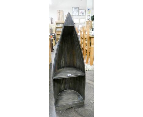 A small boat shaped reclaimed timber bookcase or display shelf with painted decoration 