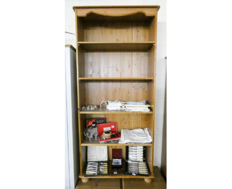 A light oak finished open bookcase approx 2'6 wide 