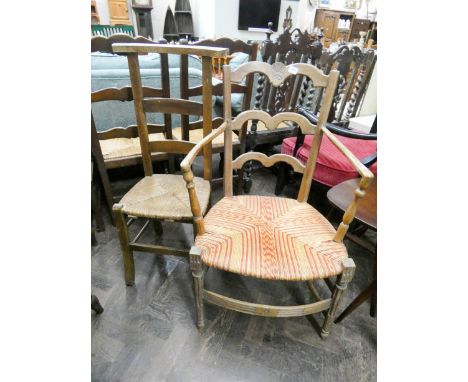 An oak ladder back prayer chair and an open armchair 