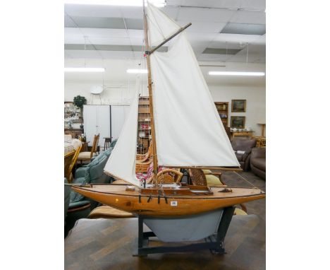 A model pond yacht with sails on stand approx 42" long 