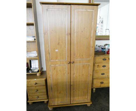 A light oak finished modern oak two door wardrobe 2'9 wide 