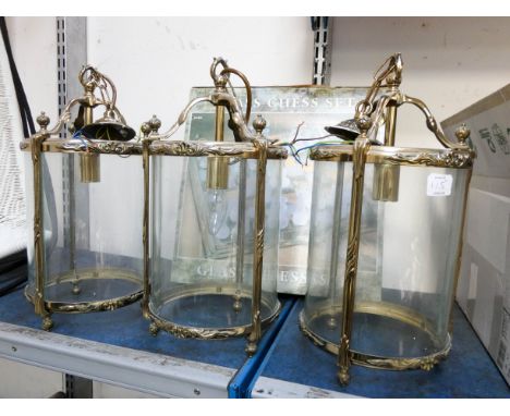 A glass chess set, three brass and glass hanging lights, one aluminium light and two new lantern shaped lights 