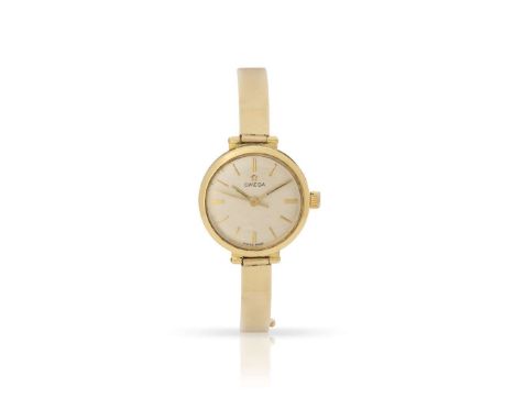  Omega. A Ladies 18k yellow gold wristwatch on associated 9k gold bracelet Case No. 531001, Movement No.20269035, 1960s Cal.6