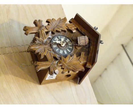 CUCKOO CLOCK. Black Forest style wooden cuckoo clock