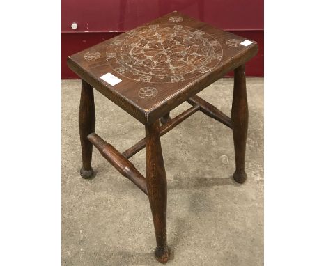 A 19th Century carved elm stool 