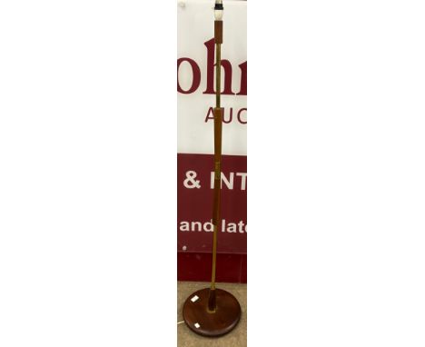 A teak standard lamp 