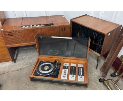 A HMV teak stereogram, Decca Sound, Compact 3 teak radiogram and a teak and glass sliding door record cabinet