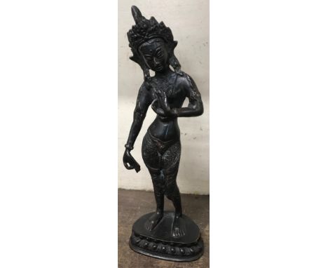 A bronze figure of a deity 
