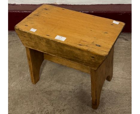 An early 20th Century pine milking stool 