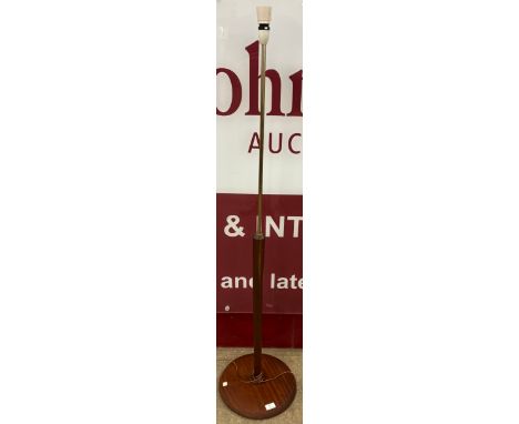 A teak standard lamp 