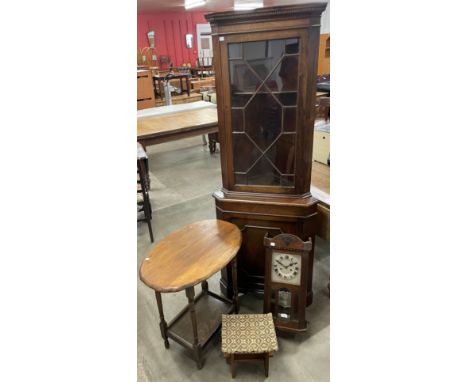 A George III style mahogany corner cabinet, oak occasional table, an oak wall clock and a stool