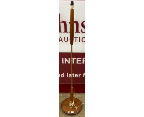 A teak standard lamp 