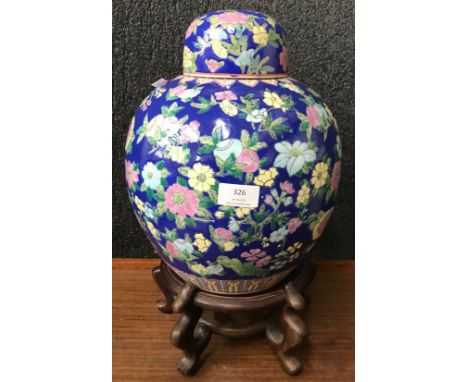 A Chinese famille bleur porcelain ginger jar and cover on hardwood stand 