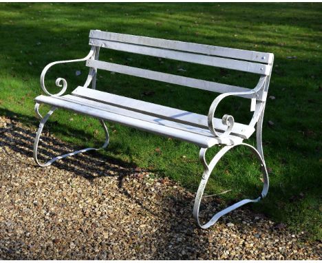 A painted wrought iron and slatted  wood garden bench, early 20th century, with scrolled armrests above arching legs   83cm h